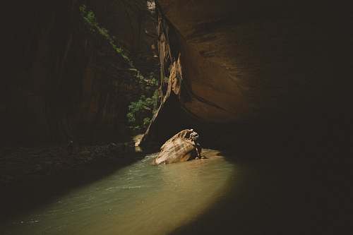 cave light rays on rock mountain near sea the narrows